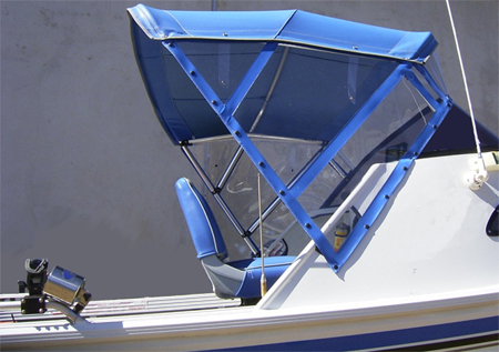 Blue bimini top fitted over a runabout's helm seat