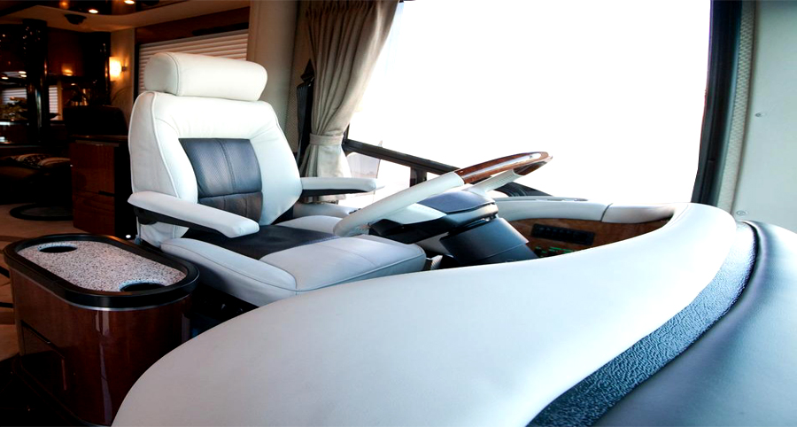 Motorhome driver's seat reupholstered in white and grey