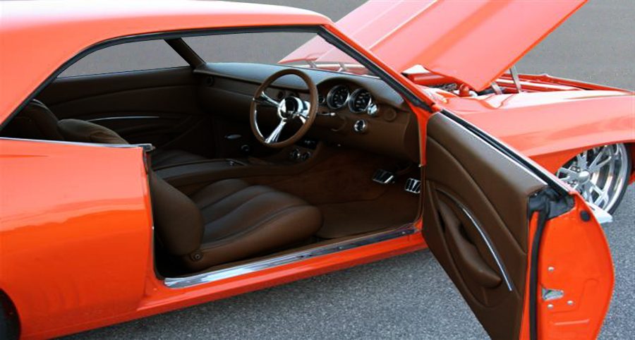 Orange classic coupe with a retrimmed brown interior