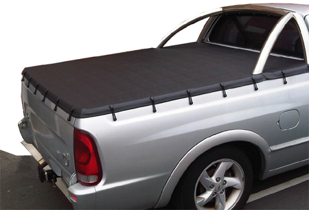Black tonneau cover fitted to a silver ute